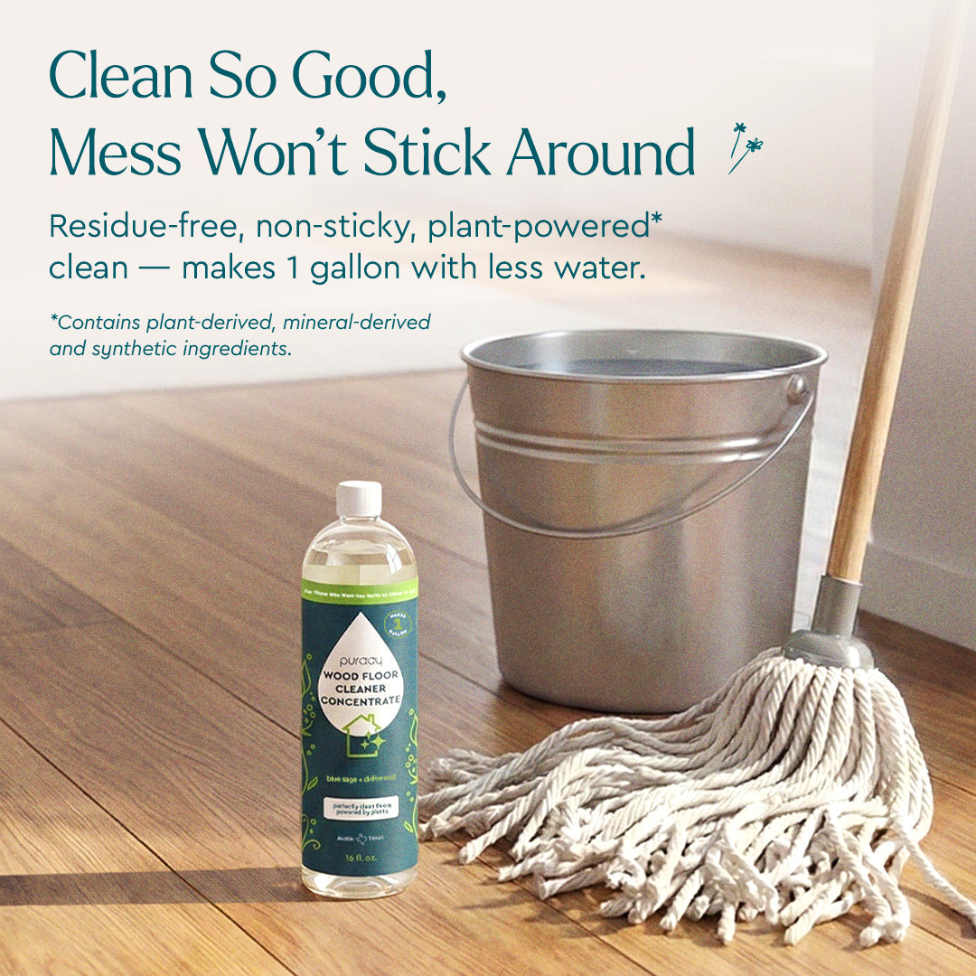 Puracy Everyday Multi-Surface Cleaner bottle next to a clean wooden floor, highlighting its multi-surface cleaning capability.