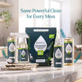 Puracy Everyday Multi-Surface Cleaner bottle and spray on a wooden floor, suitable for cleaning various surfaces in the home.