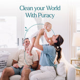 Puracy everyday multi-surface cleaner bottle next to a clean wooden floor, showcasing natural cleaning product for multiple surfaces.