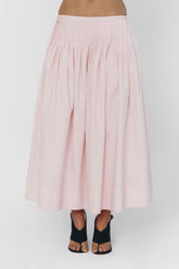 Findmenowthelabel UIARA skirt in baby pink, soft fabric with a stylish, flowy design perfect for casual or dressy occasions.