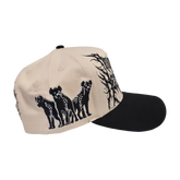 Black roaming hat by Any Means Necessary Clothing, featuring a wide brim and adjustable strap, shown from a side view.