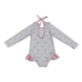 Mini Rodeo long sleeves floral baby girls one-piece swimsuit with bow detail, perfect for sun protection and cute beachwear.