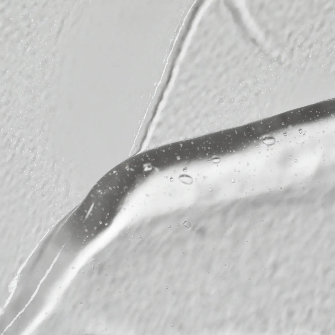 Swatch of Solawave Light Therapy Boosting Wand Activating Serum for skincare topicals, showing its smooth, clear gel texture.