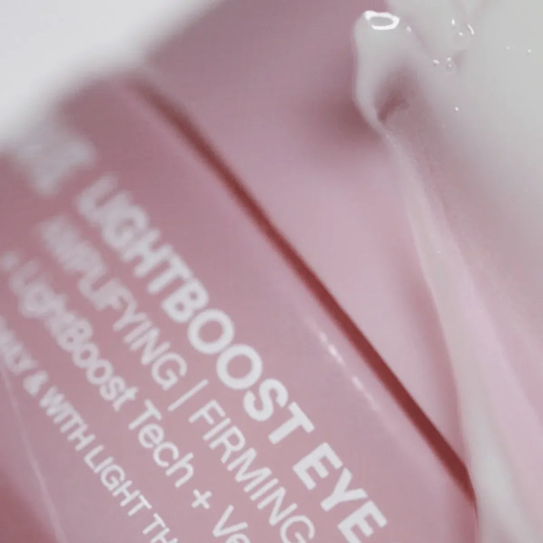Solawave Light Therapy Boosting Eye Cream in a sleek jar, designed to reduce puffiness and brighten under-eye skin.