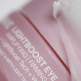 Solawave Light Therapy Boosting Eye Cream in a sleek jar, designed to reduce puffiness and brighten under-eye skin.