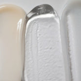 Solawave Light Therapy Boosting Wand Activating Serum in a sleek skincare topical bottle with a pump applicator.