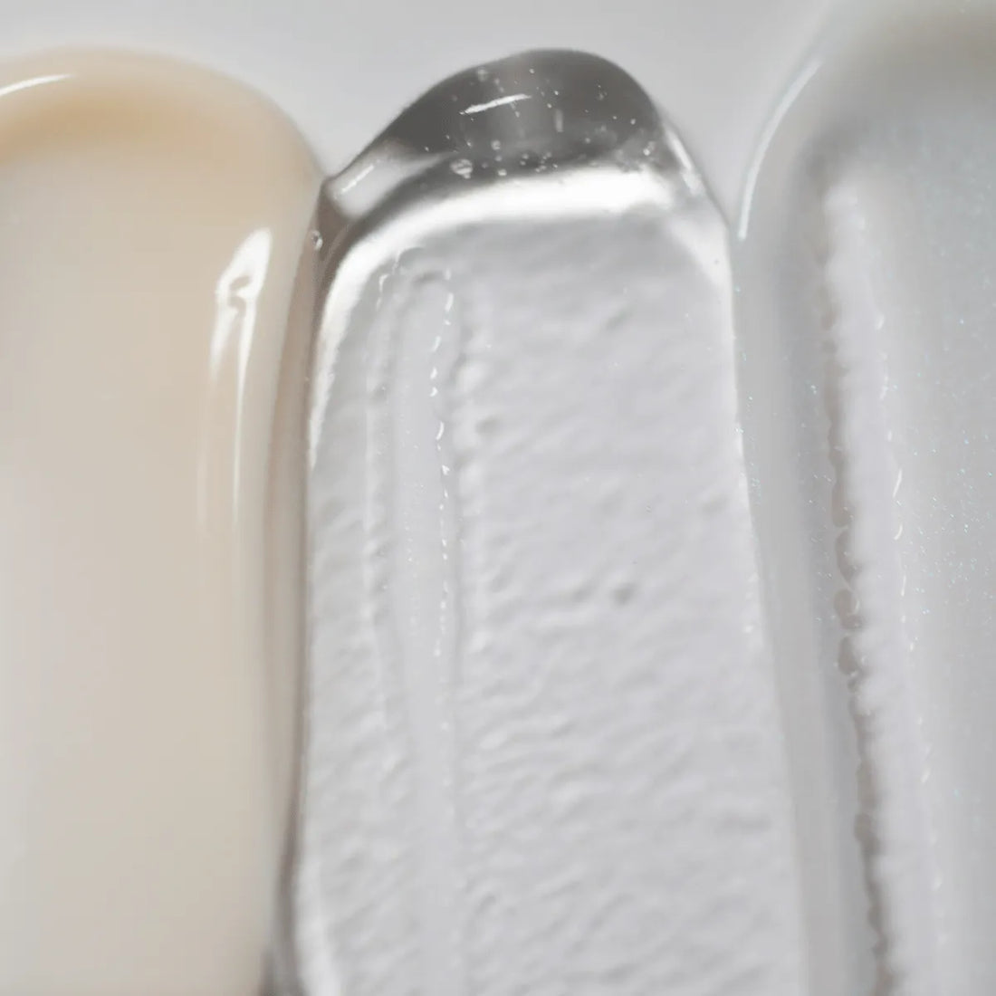 Solawave Light Therapy Boosting Face &amp; Neck Serum swatch showing smooth, hydrating skincare topicals in a sleek container.