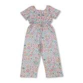 Pink floral girl jumpsuit with short sleeves and pockets by Mini Rodeo, perfect for kids and girls.