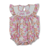 Pink floral baby girl romper with smocked detail from Mini Rodeo, perfect for summer wear and adorable photos.