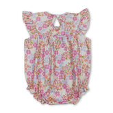 Pink floral smocked baby girl romper by Mini Rodeo with "I love dad" embroidery, perfect for summer and warm weather.