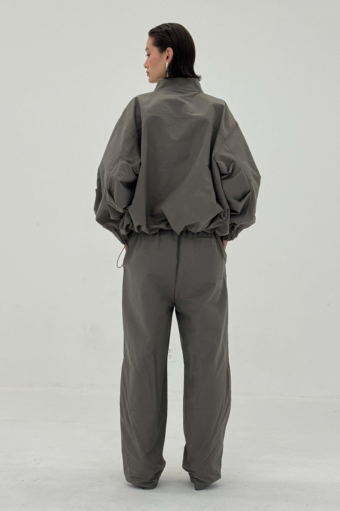 Charcoal Sable pants by findmenowthelabel featuring a relaxed fit and modern design, displayed on a neutral background.