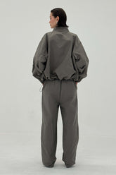 Charcoal Sable pants by findmenowthelabel featuring a relaxed fit and modern design, displayed on a neutral background.