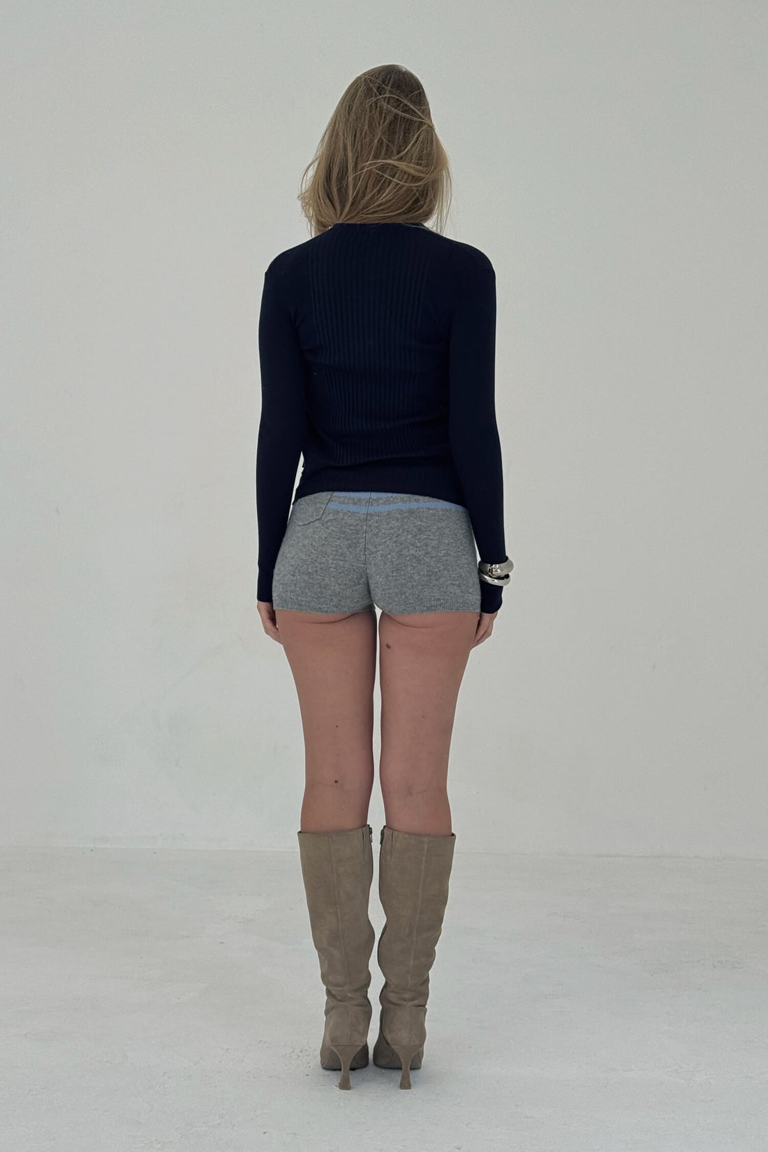 Navy ribbed knit cardigan from findmenowthelabel, featuring a cozy, textured knitwear design with a button-front closure.
