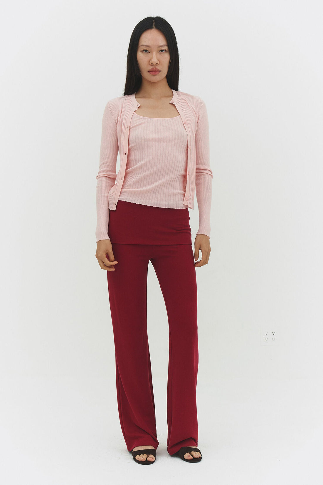 Findmenowthelabel ribbed knit cardigan in powder pink, showing the soft textured fabric and classic fit.
