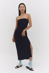 Findmenowthelabel navy skirt featuring a stylish, fitted design, shown hanging on a rack with a smooth fabric finish.