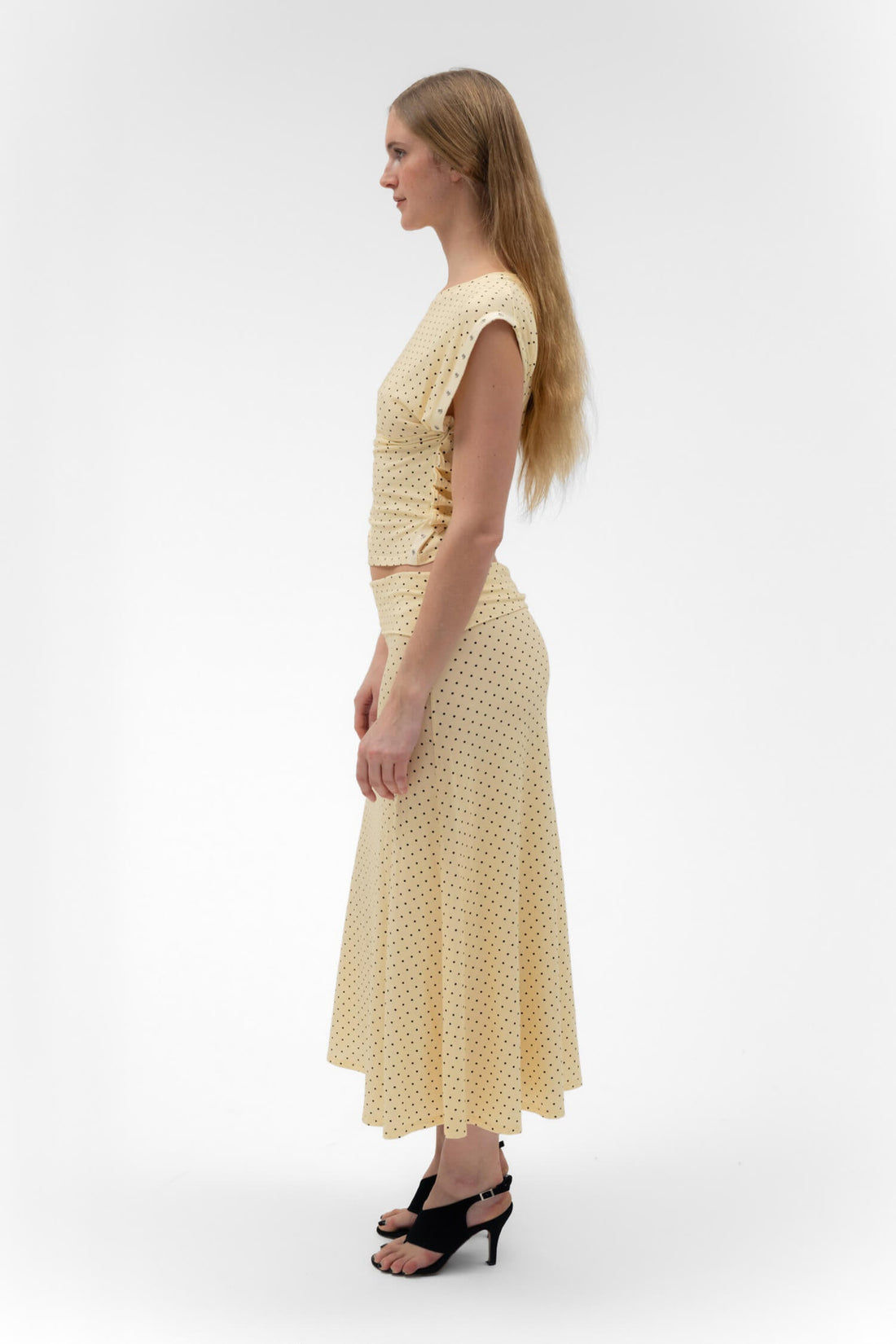 Findmenowthelabel foldover flared maxi skirt in butter color, featuring a midi length and flowing silhouette.