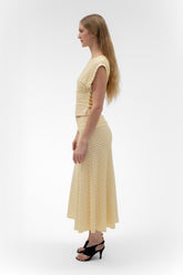 Findmenowthelabel foldover flared maxi skirt in butter color, featuring a midi length and flowing silhouette.