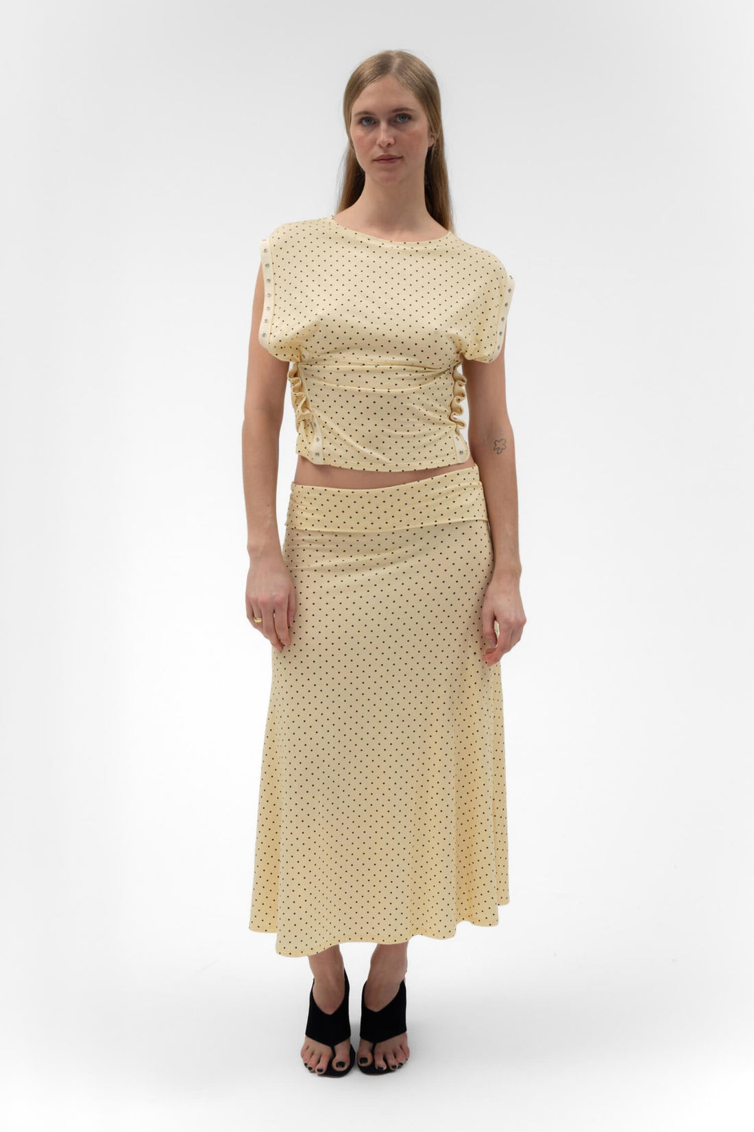 Foldover flared maxi skirt in butter color by findmenowthelabel, featuring a flowing midi silhouette and stylish design.