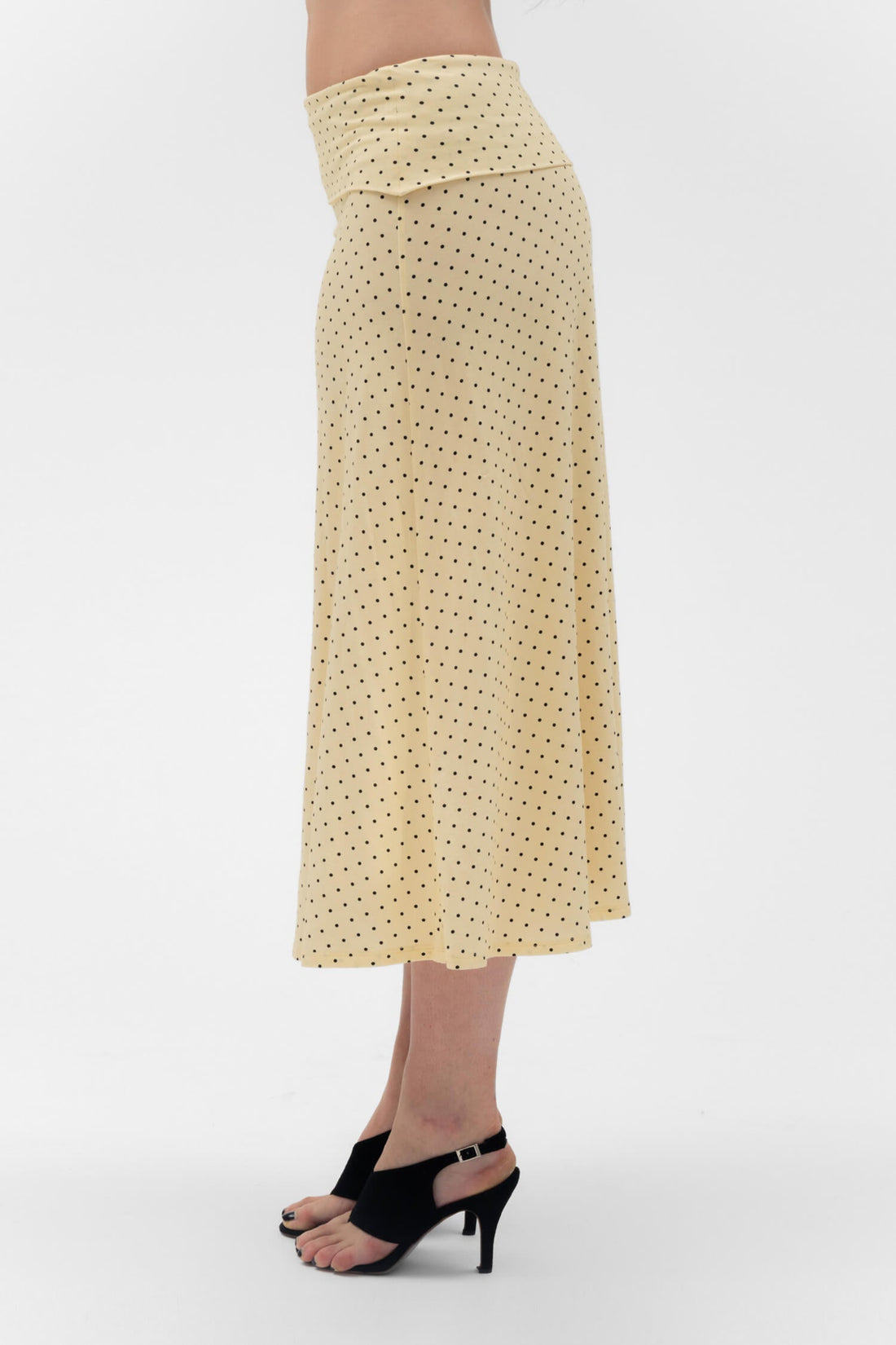 Findmenowthelabel foldover flared maxi skirt in butter color, showcasing soft fabric and flowing silhouette.