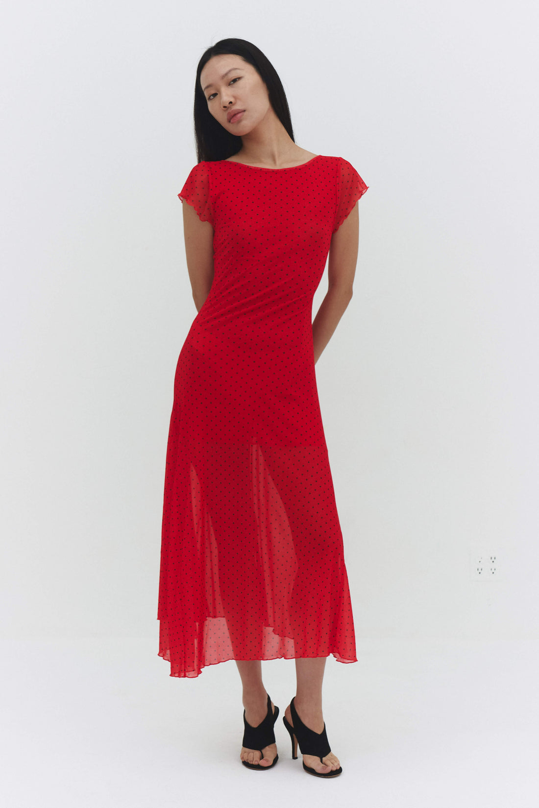 Red VALENTINA Maxi Dress by findmenowthelabel, flowing fabric, sleeveless design, and elegant length shown in the image.