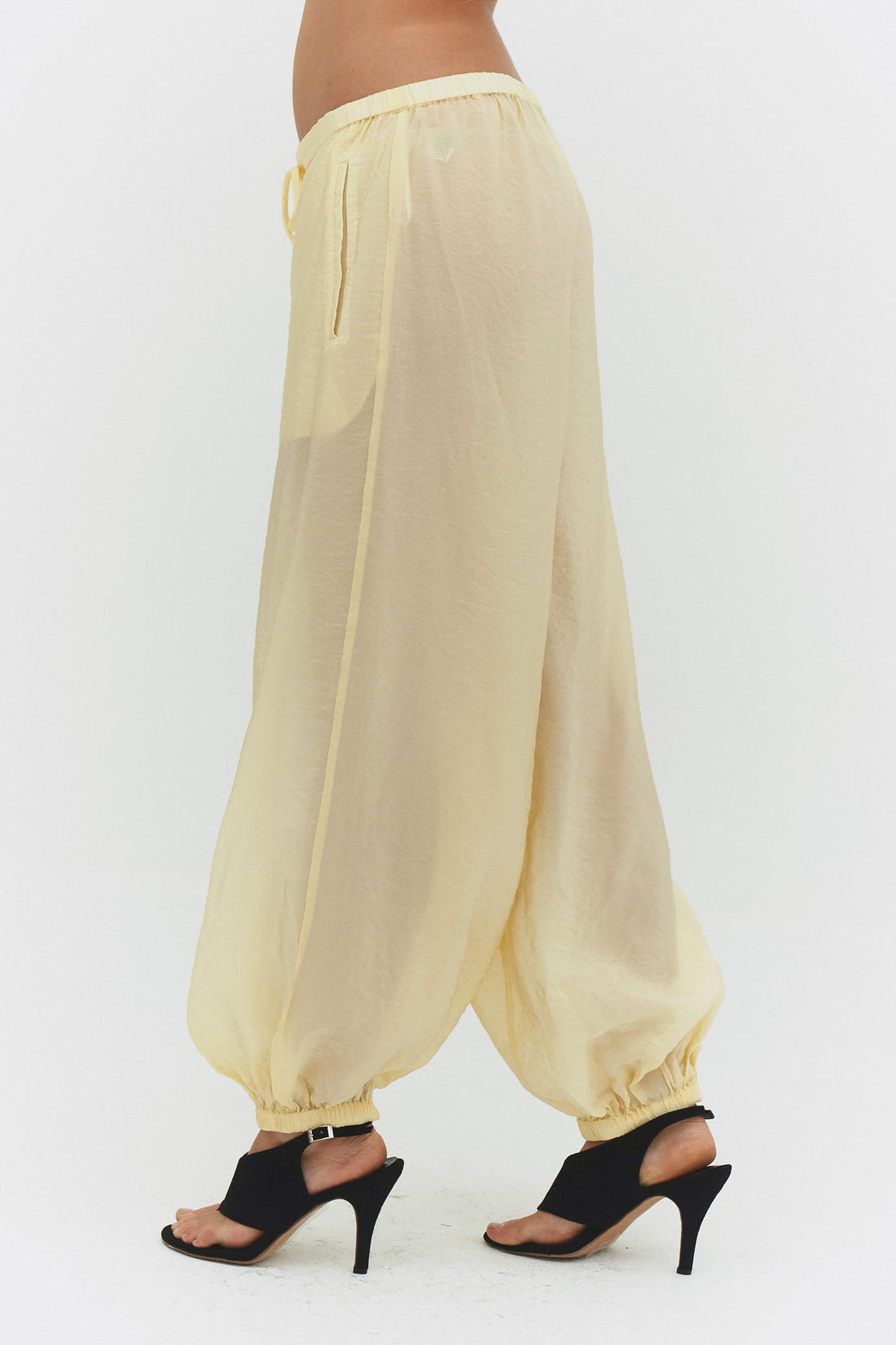 Findmenowthelabel ZORA voile pant in butter, showing soft, lightweight fabric and relaxed fit in a bright butter color.