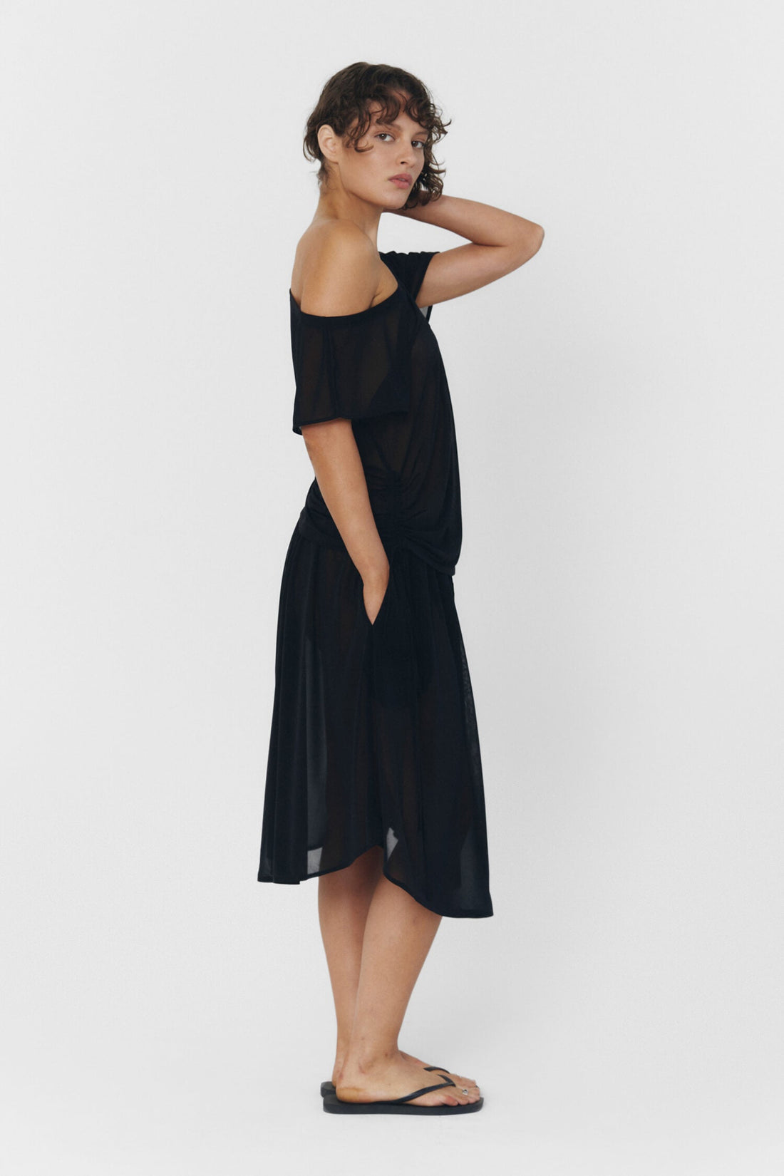 Black BRISA top by findmenowthelabel displayed on a model, featuring a sleek, fitted design perfect for casual or dressy outfits.