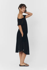 Black BRISA top by findmenowthelabel displayed on a model, featuring a sleek, fitted design perfect for casual or dressy outfits.