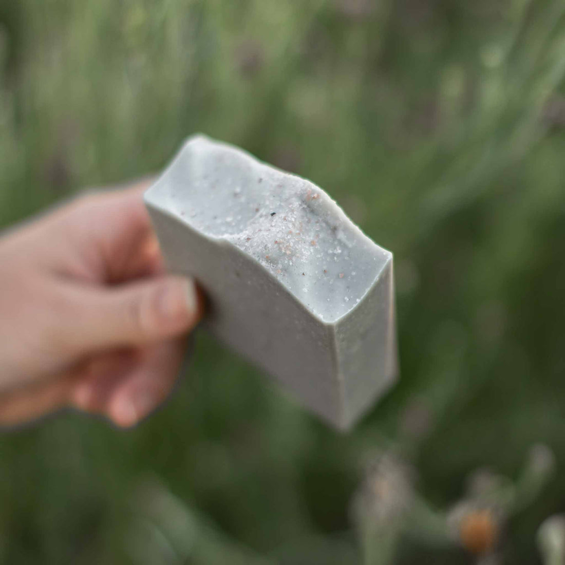 Handmade salt and sea tallow goat milk soap bar by Pretty Farm Girl, showing a rustic, natural soap bar with salt and sea elements.