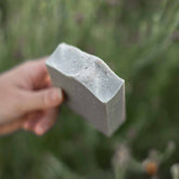 Handmade salt and sea tallow goat milk soap bar by Pretty Farm Girl, showing a rustic, natural soap bar with salt and sea elements.