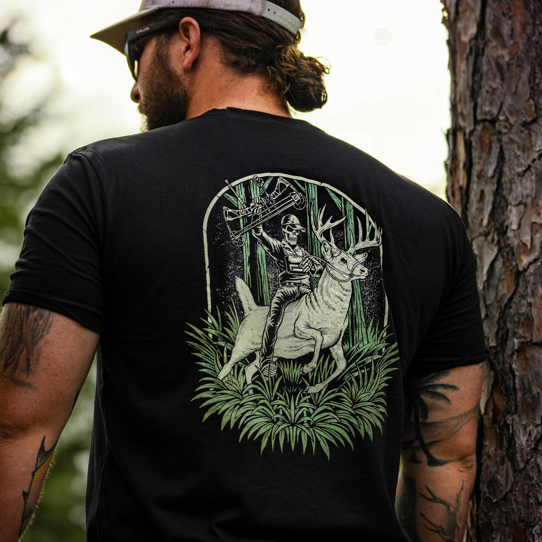 Pink Buck Wrangler T-shirt by Bow Crew Apparel featuring a buck graphic and casual fit, ideal for bow hunting enthusiasts.