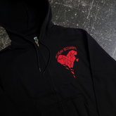 Black Sharp Edges zip-up hoodie by Any Means Necessary Clothing, front view showing the hoodie’s zip closure and sharp edge design.