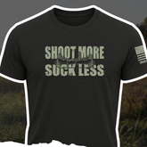 Black Bow Crew Apparel "Shoot More Suck Less" T-shirt with bold white text, casual fit, perfect for bow hunting enthusiasts.