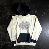 Cream-colored Sigil Pullover Hoodie by Any Means Necessary Clothing shown from the front with a relaxed fit and detailed sigil design.