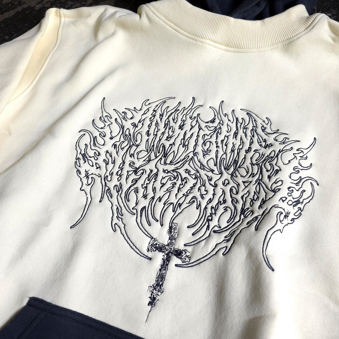 Cream Sigil Pullover Hoodie by Any Means Necessary Clothing, front view showing detailed sigil design and comfortable fit.
