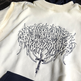 Cream Sigil Pullover Hoodie by Any Means Necessary Clothing, front view showing detailed sigil design and comfortable fit.