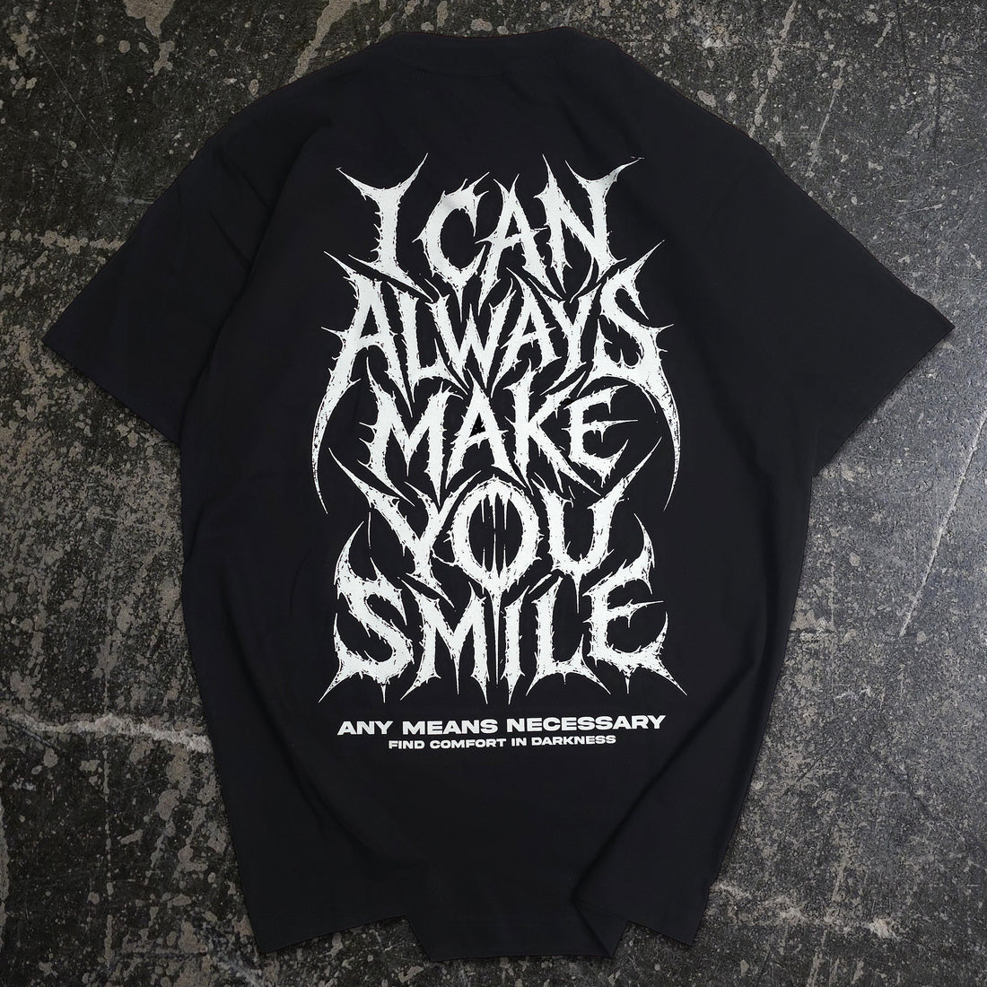 Black Always Smile T-shirt by Any Means Necessary Clothing showing the back with a smile graphic design.