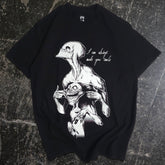 Black Always Smile T-shirt by Any Means Necessary Clothing featuring a front graphic of a smiling face on soft cotton fabric.