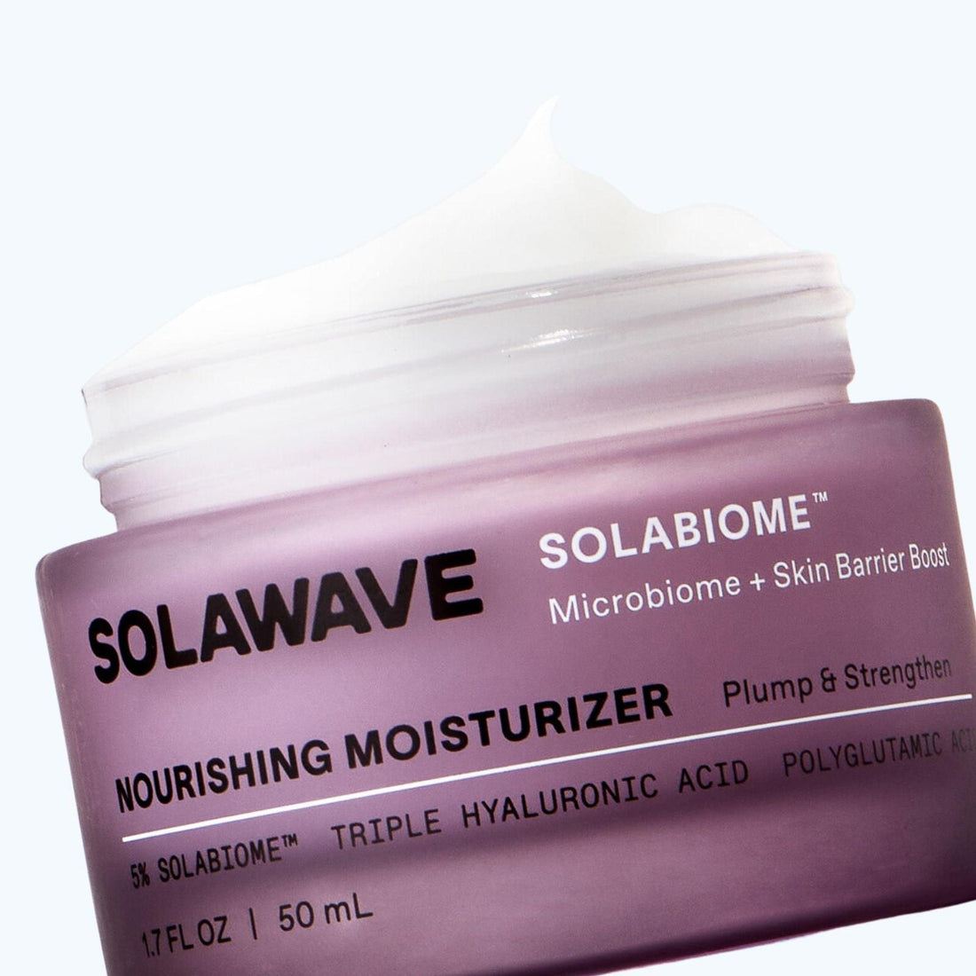 Solawave Solabiome Pre- &amp; Probiotic Nourishing Moisturizer jar with white and green packaging and a silver lid.