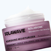 Solawave Solabiome Pre- & Probiotic Nourishing Moisturizer jar with white and green packaging and a silver lid.