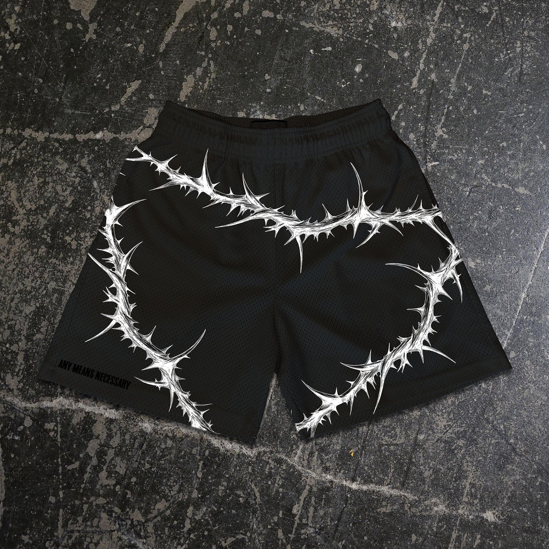 Black Spina Noctis shorts by Any Means Necessary Clothing, featuring a comfortable fit and stylish design for casual wear.