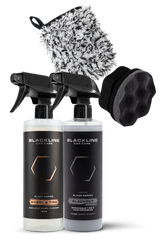Blackline Car Care BLACKLINE® Blackout Trim and Tire Dressing spray being applied to vehicle trim and tires for a sleek finish.