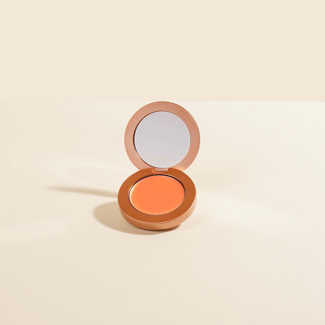 YENSA Super Serum Silk Buildable Cream Blush in Peach Sunset, smoothly blended on the skin with a natural glow.