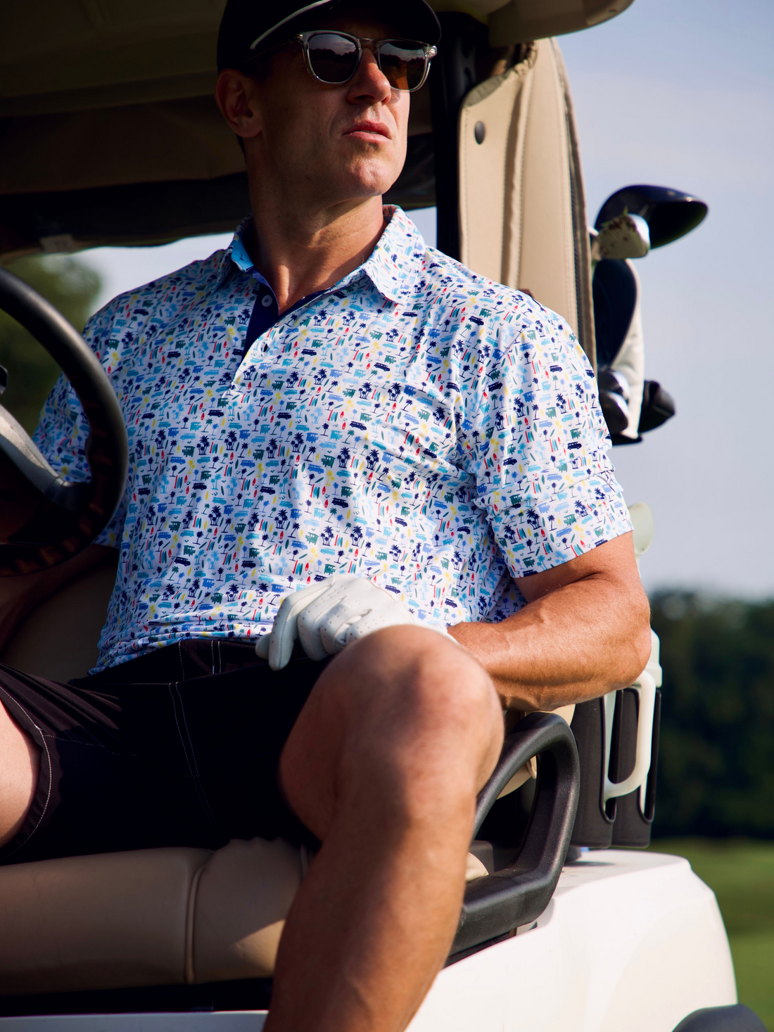 White Water Life Surfs Up Performance Polo showing a stylish polo shirt with surf-inspired design in a casual seaside setting