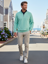 White Water Life Turnberry Aqua quarter zip sweater made of smooth knit fabric, displayed in a lifestyle setting.