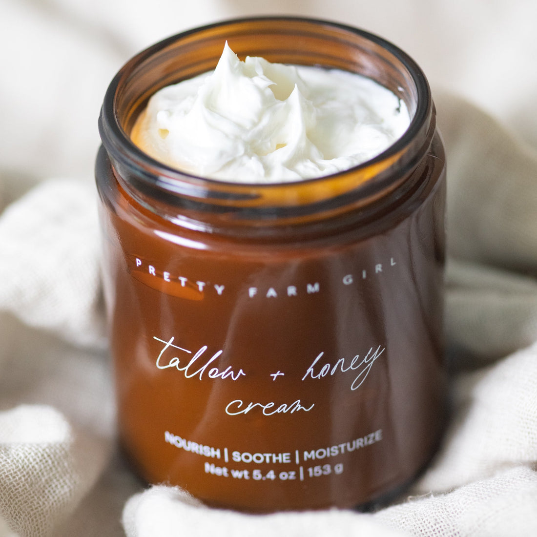 Cream for sensitive skin with tallow and honey by Pretty Farm Girl, showing the fragrance-free, nourishing skincare product.
