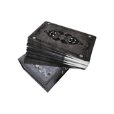 Image of a Tarot deck in a decorative box, featuring intricately designed tarot cards from the Any Means Necessary Clothing Tarot deck.