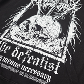 Close-up of Any Means Necessary Clothing Defeatist hoodie showing detailed fabric texture and subtle logo design.