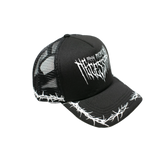 Black Thorns Trucker Hat from Any Means Necessary Clothing featuring a structured cap with mesh back and thorn design.