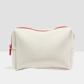 Beige toiletry travel bag by Duradry with multiple compartments and zipper closure for organized packing.