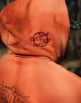 Orange Trophy Pullover Hoodie by Any Means Necessary Clothing, shown with front view and drawstring hood.